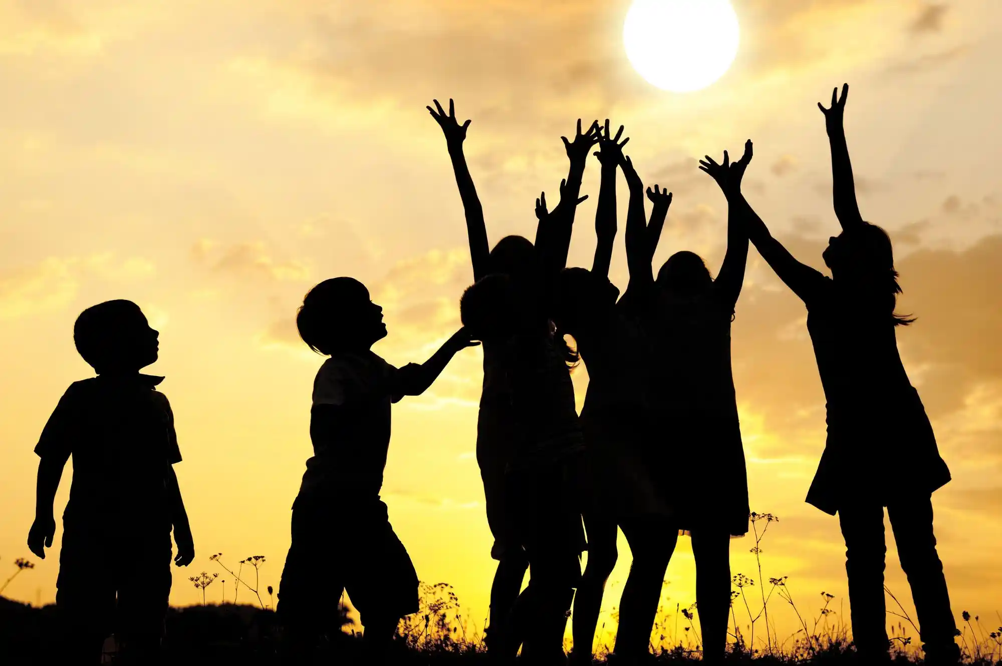 Children from a Baja California orphanage playing and smiling together outdoors
